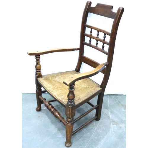 3113 - An 18th century oak rush seated elbow chair. Not available for in-house P&P, contact Paul O'Hea at M... 