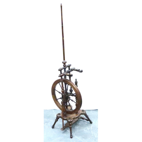 3116 - An early 19th century European fruitwood tredle spinning wheel of small proportions with turned and ... 