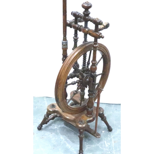 3116 - An early 19th century European fruitwood tredle spinning wheel of small proportions with turned and ... 