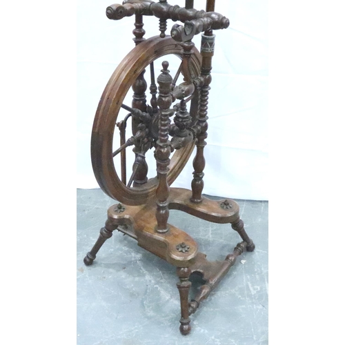 3116 - An early 19th century European fruitwood tredle spinning wheel of small proportions with turned and ... 