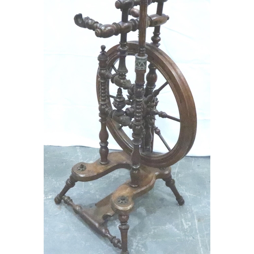 3116 - An early 19th century European fruitwood tredle spinning wheel of small proportions with turned and ... 