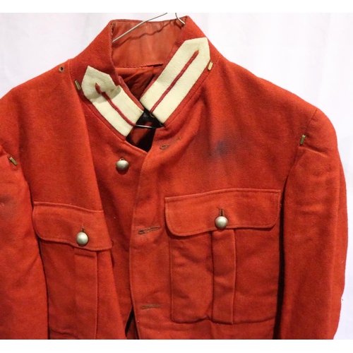 2051 - A 19th century British military tunic in red, some small areas of moth damage, and discolouration to... 