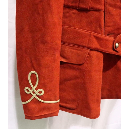 2051 - A 19th century British military tunic in red, some small areas of moth damage, and discolouration to... 