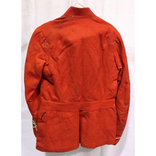 2051 - A 19th century British military tunic in red, some small areas of moth damage, and discolouration to... 