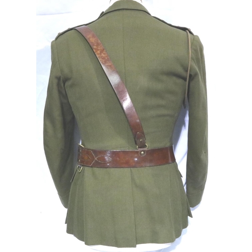 2071 - Royal Engineers British WWII uniform tunic with leather Sam Browne belt. Tunic pocket has a 1940s Mo... 