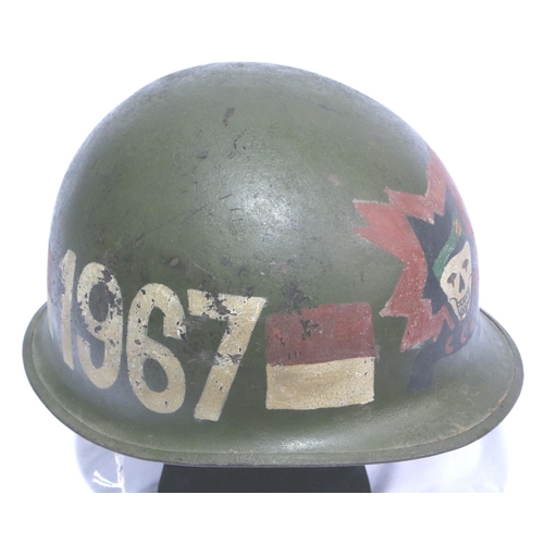 2135 - American Vietnam War period M1 steel helmet with  painted war memorial, dated 1967. P&P Group 2 (£18... 