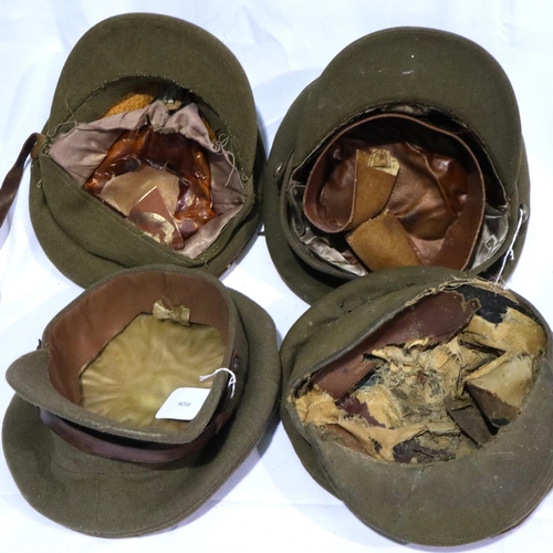 2143 - Four British WWI and WWII military visor caps in varying condition. P&P Group 2 (£18+VAT for the fir... 