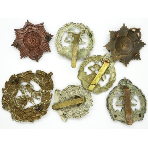 2263 - Seven WWI Royal Hampshire Regiment cap badges. P&P Group 1 (£14+VAT for the first lot and £1+VAT for... 