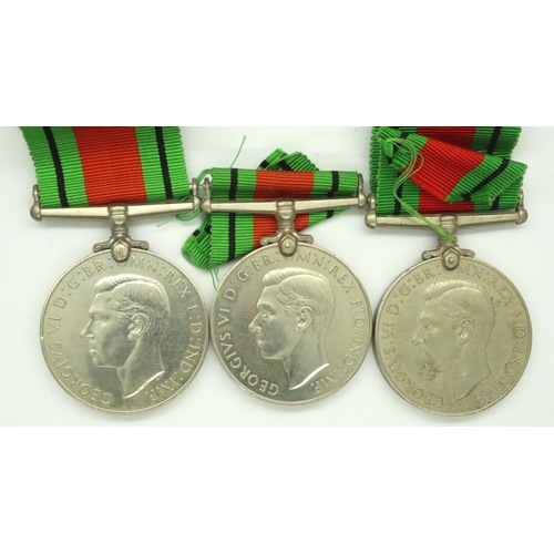 2279 - Three WWII Defence medals, two with boxes named to King (Swansea) and Barrell (Warrington). P&P Grou... 