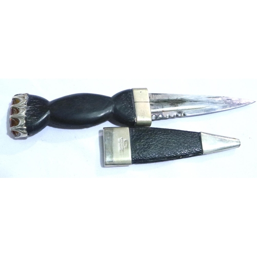 2299 - A Scottish sgian-dubh, having a stone set grip and leather sheath. P&P Group 2 (£18+VAT for the firs... 