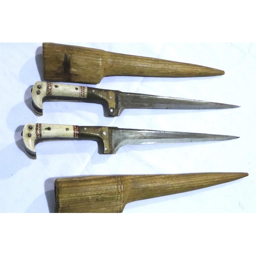 2301 - Two Afghan Orakzai Tribe Klyber knives in wooden sheaths, the grips of bone with inlaid detail, each... 