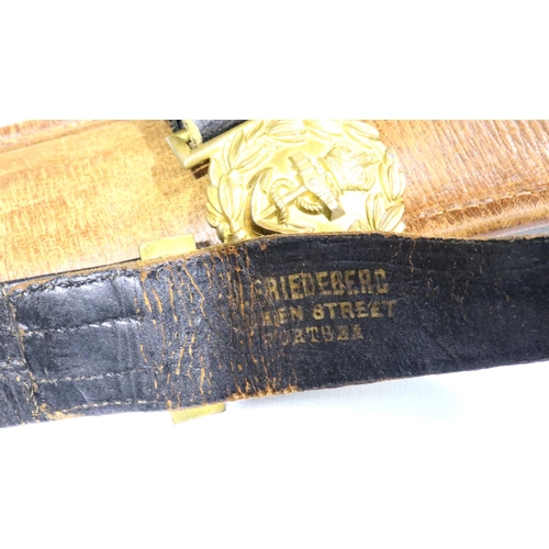 2322 - Naval Commanders parade sword, having gilt brass guard, acid etched blade and metal mounted scabbard... 