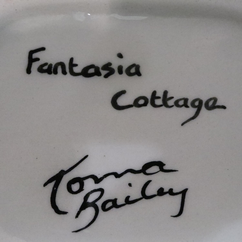 285 - Lorna Bailey Art Deco jug in the Fantasia Cottage pattern, H: 19 cm. No cracks, chips or visible res... 