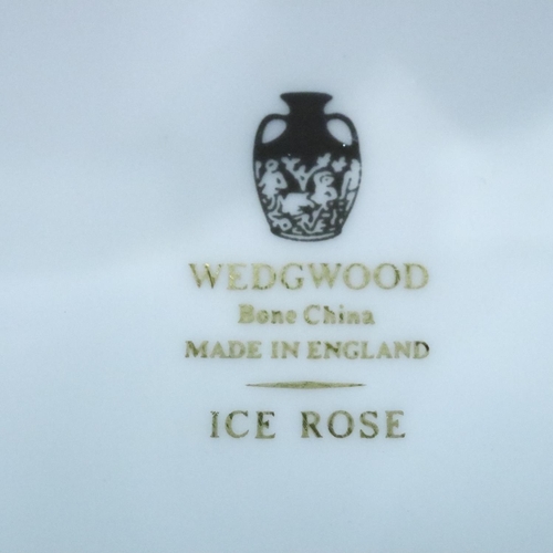 296 - Large quantity of Wedgwood Ice Rose tea and dinnerware (70). Not available for in-house P&P