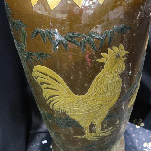 322 - 19th century glazed terracotta floor vase, slip decorated in the Oriental manner with cockerel and f... 