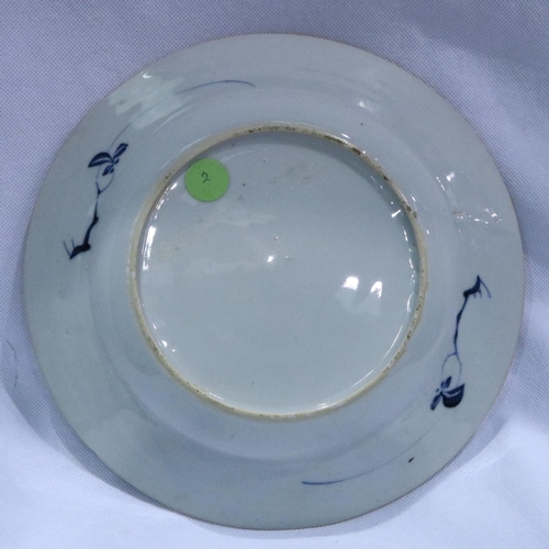 324 - Chinese ceramic plate with floral decoration, D: 23 cm. Chip to rm approximately 6 mm, some firing i... 