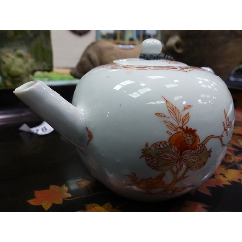 332 - Chinese ceramic teapot painted with pomegranates, H: 11 cm. Seven large chips to lid, handle has bee... 