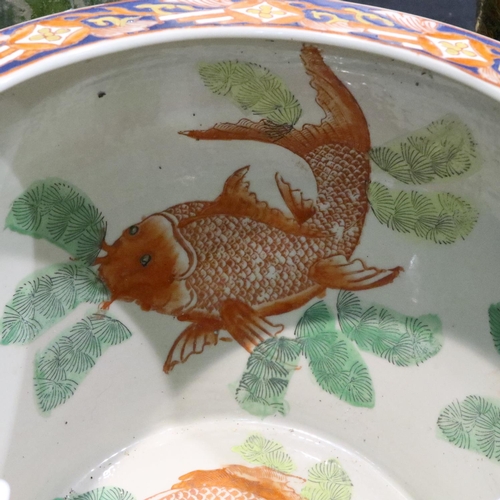 335 - Large Oriental ceramic fish bowl with character marks to base, D: 27 cm. P&P Group 3 (£25+VAT for th... 