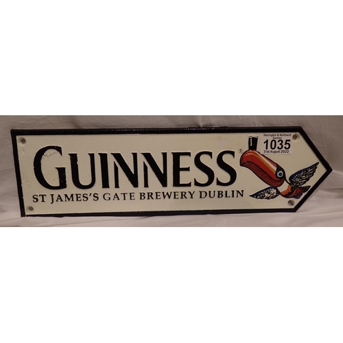 1035 - Cast iron Guinness toucan arrow, W: 35 cm. P&P Group 2 (£18+VAT for the first lot and £3+VAT for sub... 