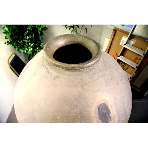 3048 - A large 18th century stoneware egg fermenting chamber, raised on museum plinth with later bronze cov... 