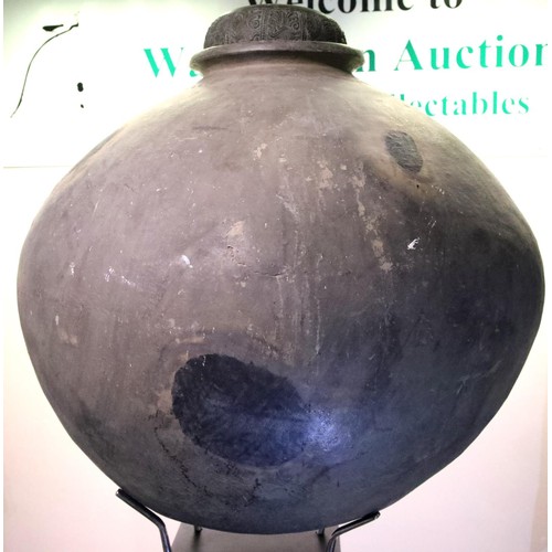 3048 - A large 18th century stoneware egg fermenting chamber, raised on museum plinth with later bronze cov... 