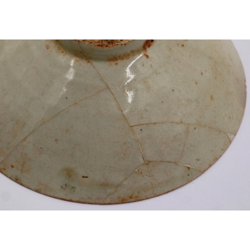 3003 - A celadon glazed porcelain bowl having incised decoration to its interior and a footed base, D: 17 c... 