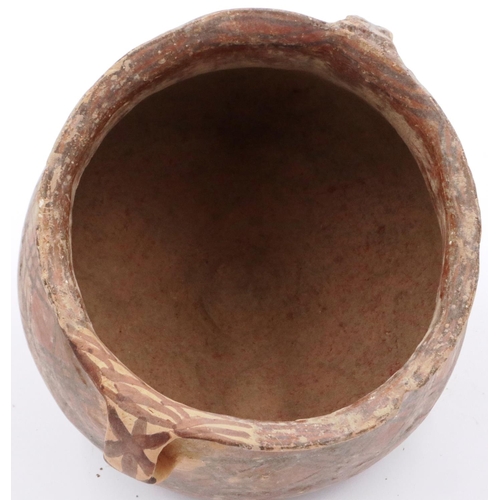 3009 - A Neolithic period terracotta pot, with flared rim and two loop handles; the upper body painted with... 