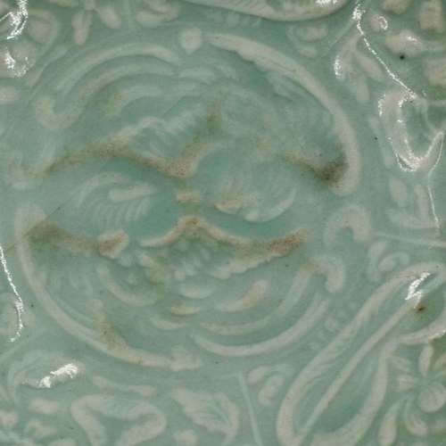 3015 - A rare Jin Dynasty celadon bowl, the interior decorated in relief with sprays of flowers and a geome... 