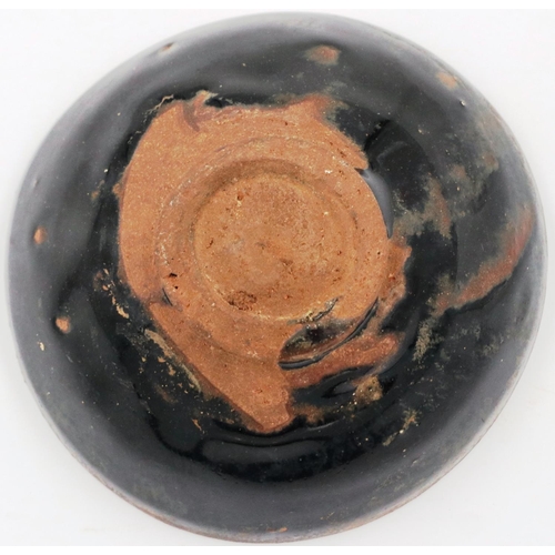 3016 - A Song Dynasty black glazed bowl, footed, D: 10 cm, H: 4 cm. P&P Group 2 (£18+VAT for the first lot ... 