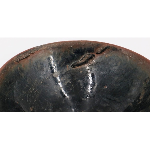 3016 - A Song Dynasty black glazed bowl, footed, D: 10 cm, H: 4 cm. P&P Group 2 (£18+VAT for the first lot ... 