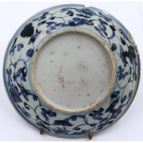 3024 - A Ming Dynasty glazed shallow bowl, with a painted circular panel depicting a dragon amongst clouds,... 