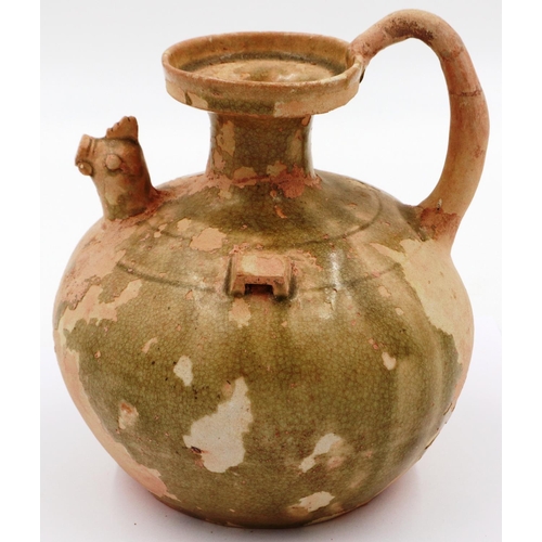 3025 - A celadon bulbous ewer, having a rooster form spout, lipped rim and still retaining some of its glaz... 