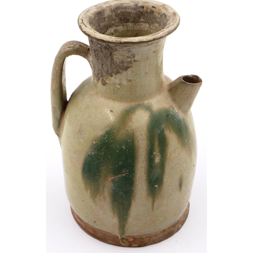 3026 - A Ming Dynasty glazed ewer, having unusual painted design to the body, flared rim and octagonal spou... 