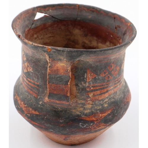 3027 - A Neolithic period painted terracotta twin handled pot, decorated with geometric designs, painted ma... 