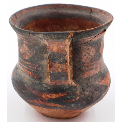 3027 - A Neolithic period painted terracotta twin handled pot, decorated with geometric designs, painted ma... 