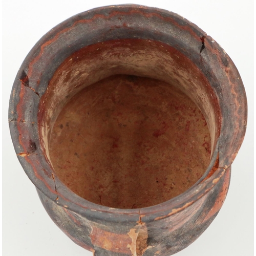 3027 - A Neolithic period painted terracotta twin handled pot, decorated with geometric designs, painted ma... 