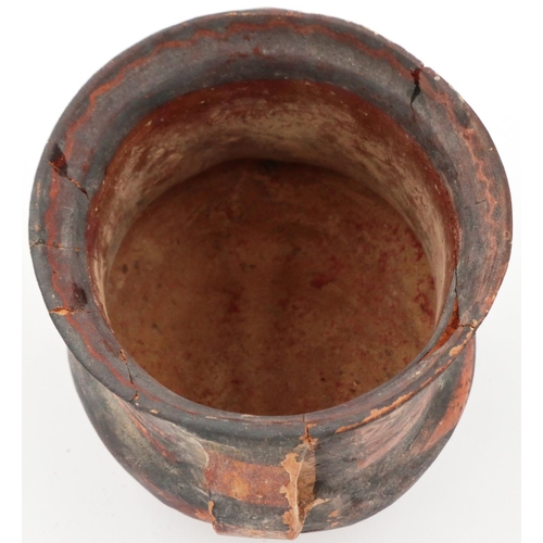 3027 - A Neolithic period painted terracotta twin handled pot, decorated with geometric designs, painted ma... 