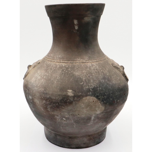 3032 - An early Qing Dynasty grey clay jar, baluster form with integral faux ring handles, footed base and ... 