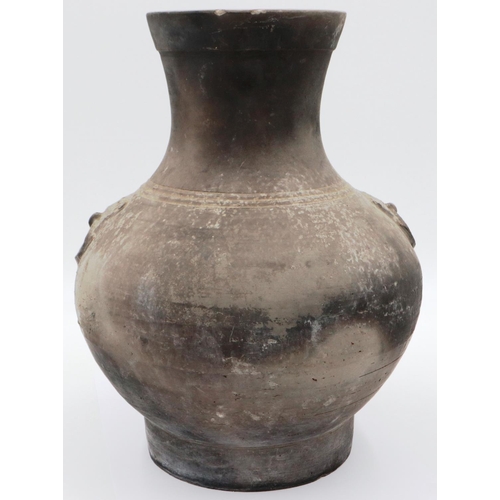 3032 - An early Qing Dynasty grey clay jar, baluster form with integral faux ring handles, footed base and ... 