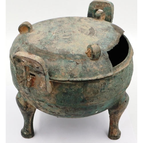 3034 - An archaic Shang Dynasty ritual bronze food vessel and cover, finely decorated by engraving througho... 