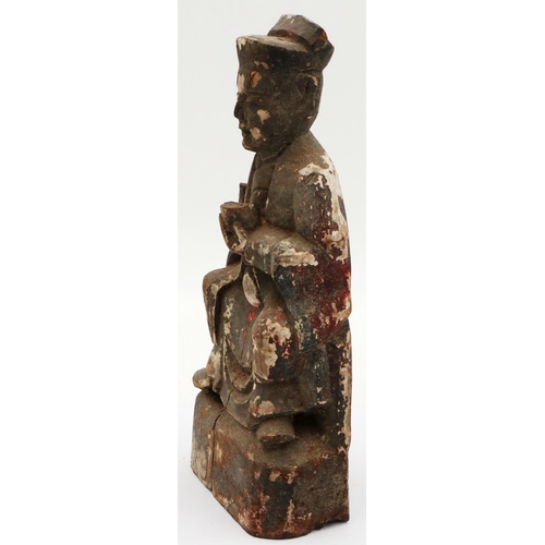 3035 - A Ming Dynasty carved wood figure of a seated official with cup, still retaining some of its origina... 