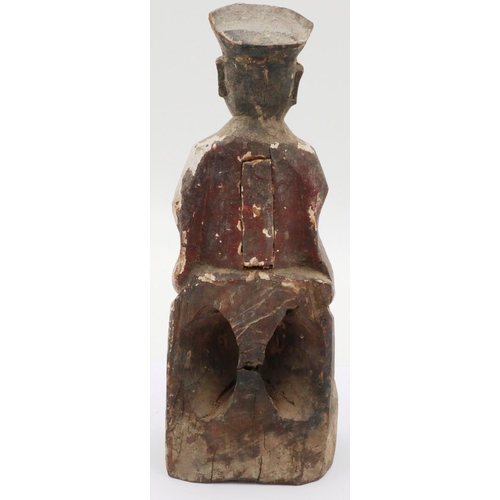 3035 - A Ming Dynasty carved wood figure of a seated official with cup, still retaining some of its origina... 