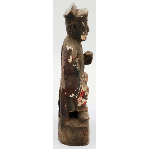 3035 - A Ming Dynasty carved wood figure of a seated official with cup, still retaining some of its origina... 