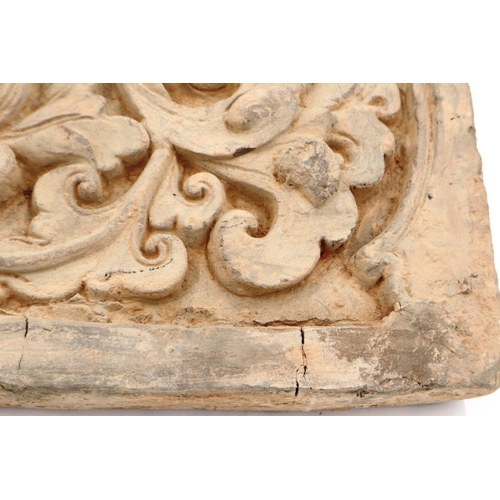 3036 - A Song Dynasty grey clay tile, decorated in high relief with a lotus flower, 19 x 36 cm.

P&P Group ... 