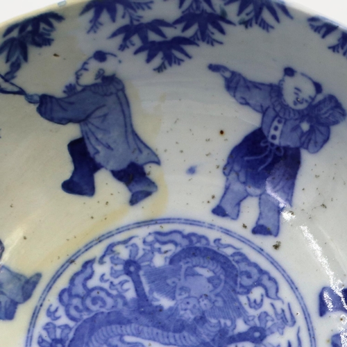 3041 - A Qianlong marked large bowl, the body and reservoir decorated with figures, flora and a dragon in t... 