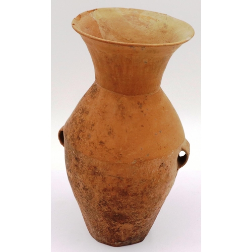 3043 - A Neolithic period terracotta vessel, having two ring handles and flared neck, the body tapering in ... 