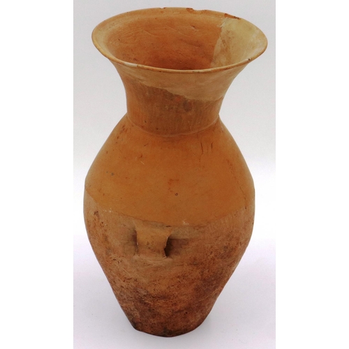 3043 - A Neolithic period terracotta vessel, having two ring handles and flared neck, the body tapering in ... 