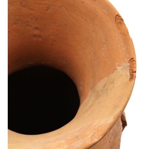 3043 - A Neolithic period terracotta vessel, having two ring handles and flared neck, the body tapering in ... 