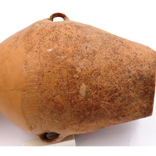 3043 - A Neolithic period terracotta vessel, having two ring handles and flared neck, the body tapering in ... 