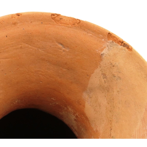 3043 - A Neolithic period terracotta vessel, having two ring handles and flared neck, the body tapering in ... 